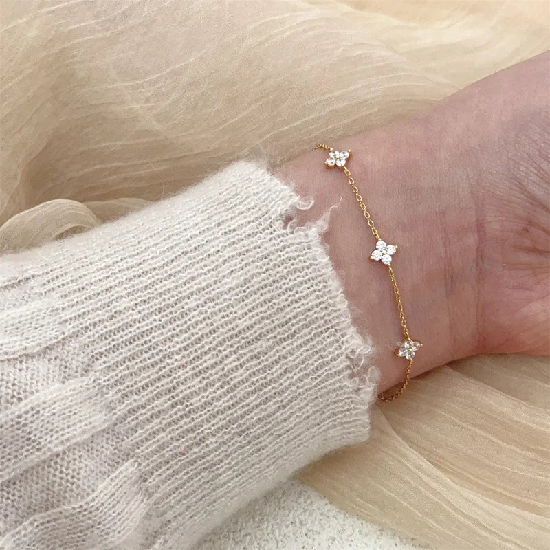 Lucky Bloom Bracelet – Silver & Gold Four-Leaf Flower CZ Chain