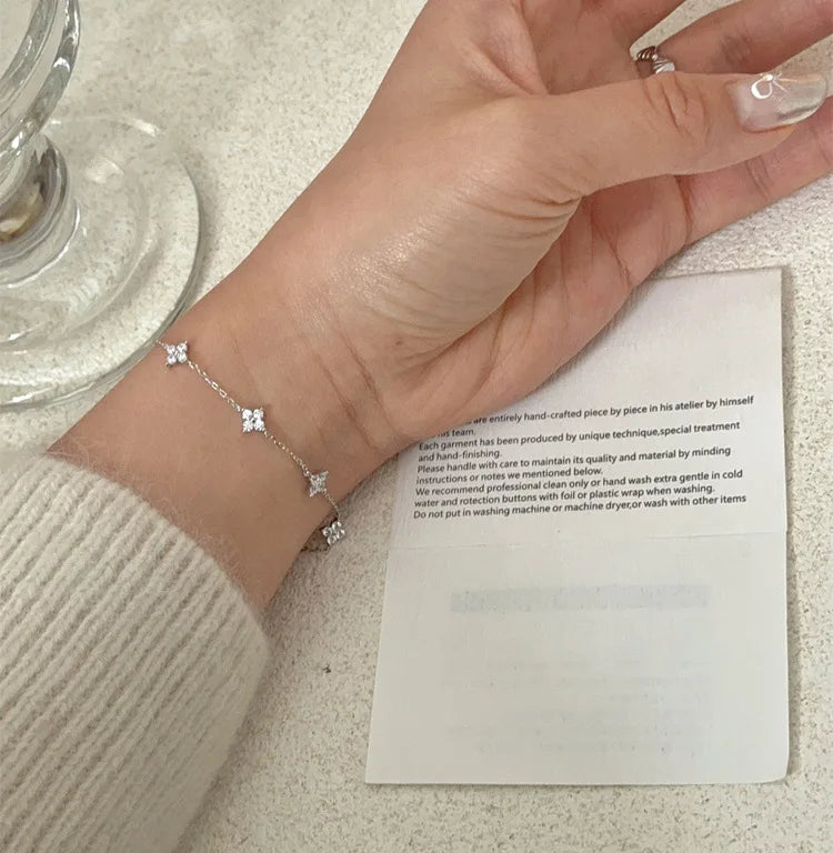 Lucky Bloom Bracelet – Silver & Gold Four-Leaf Flower CZ Chain