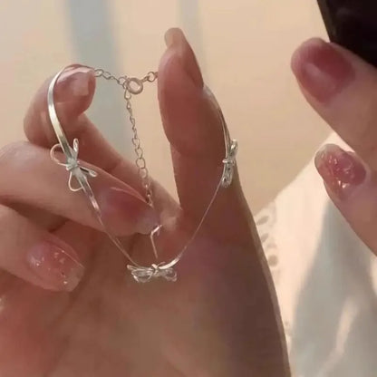 Sparkle Bow Charm Bracelet – Elegant Ribbon Chain for Women