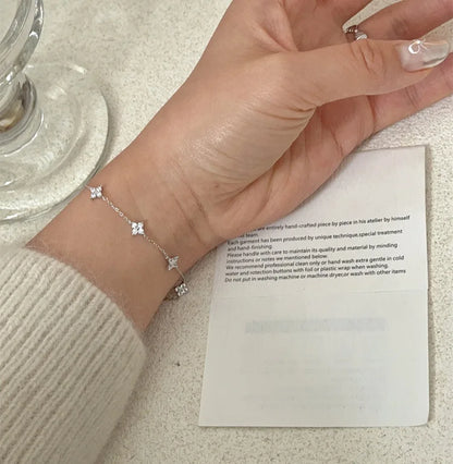 Lucky Bloom Bracelet – Silver & Gold Four-Leaf Flower CZ Chain