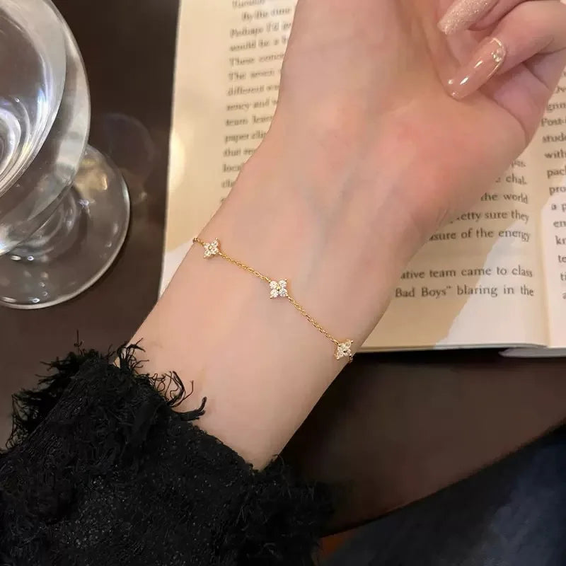 Lucky Bloom Bracelet – Silver & Gold Four-Leaf Flower CZ Chain
