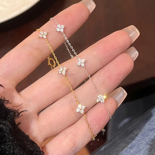 Lucky Bloom Bracelet – Silver & Gold Four-Leaf Flower CZ Chain